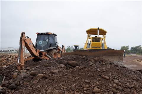 Backhoe loader and dozer working